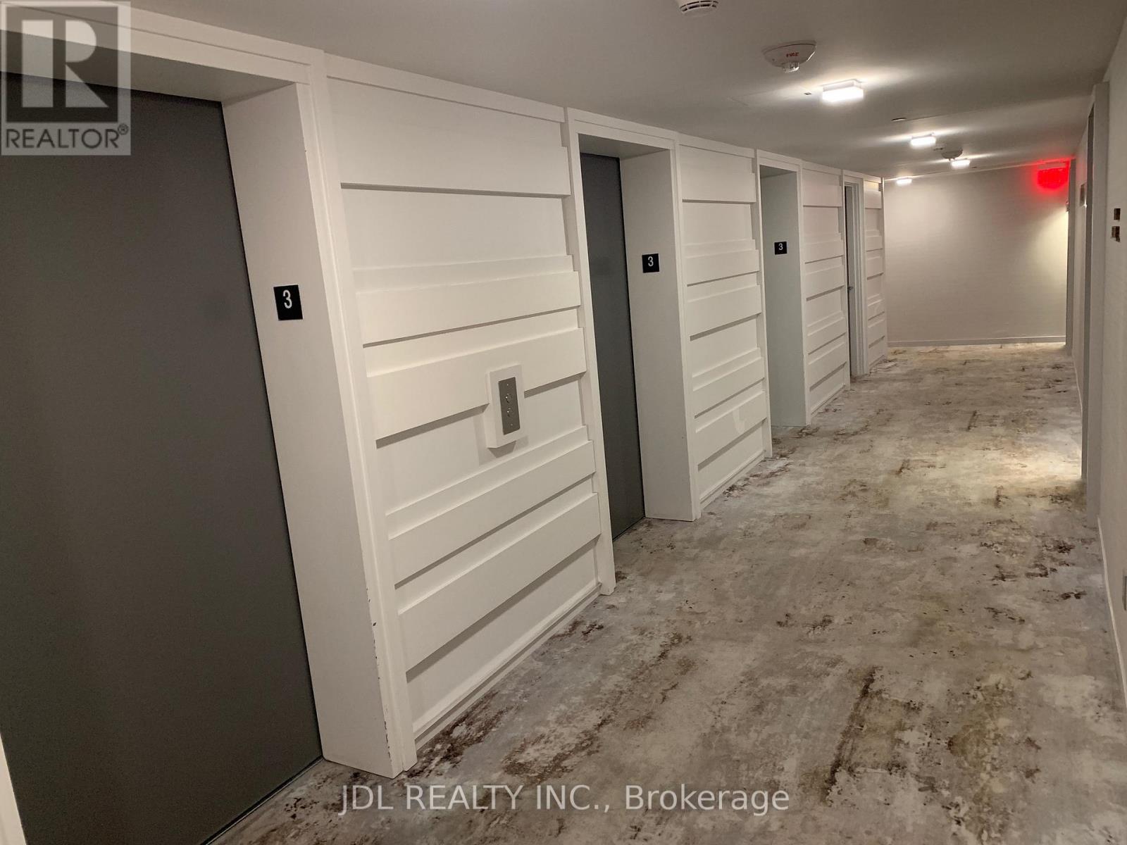 A hallway with doors numbered 3 and 4.