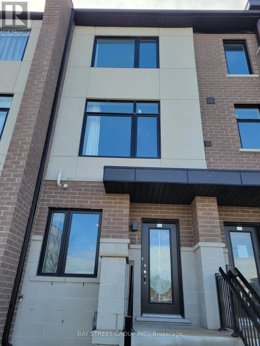 A building with a black railing in front.