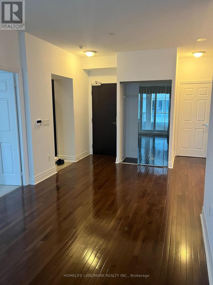 A room with wooden floors and white walls.