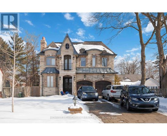A large house with a carport and a car in front.