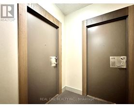 Two doors with Real One Realty Inc. logo on them.