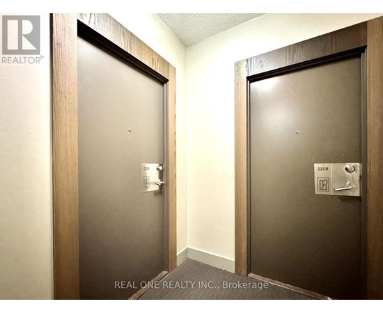 Two doors with Real One Realty Inc. logo on them.