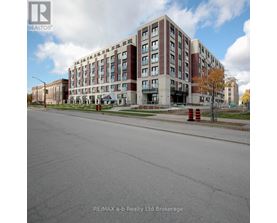 A large multi-story building with a parking lot in front.