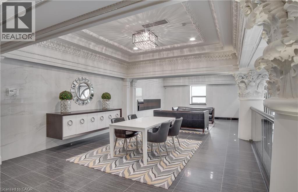 A large, elegant dining room with a long table and chairs.