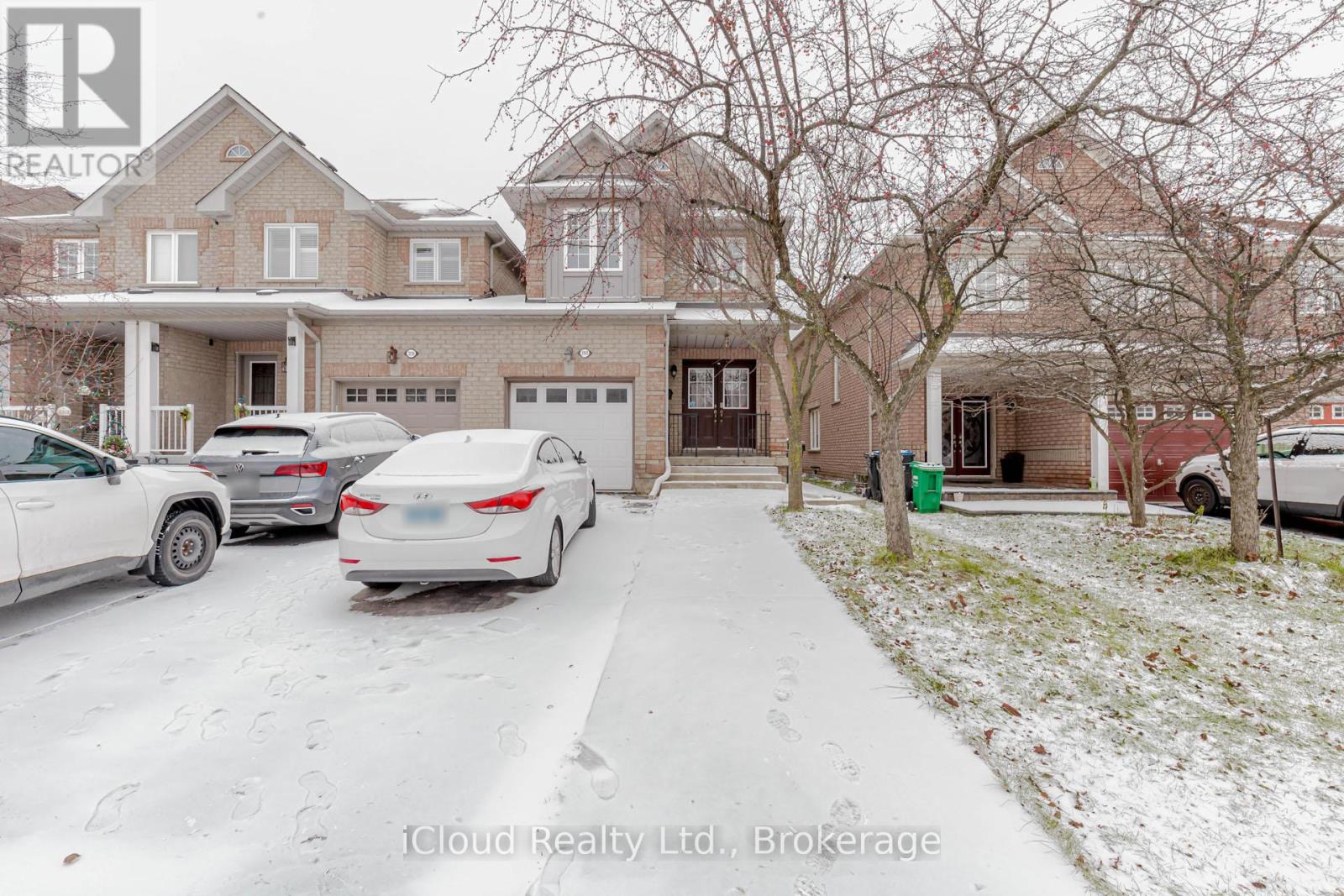 A house with a car parked in front of it.