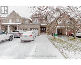 A house with a car parked in front of it.