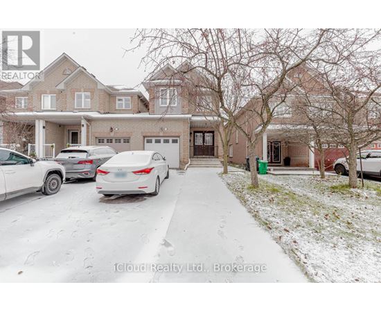 A house with a car parked in front of it.
