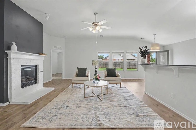 A dining room with a table, chairs, and a shelf with various items.