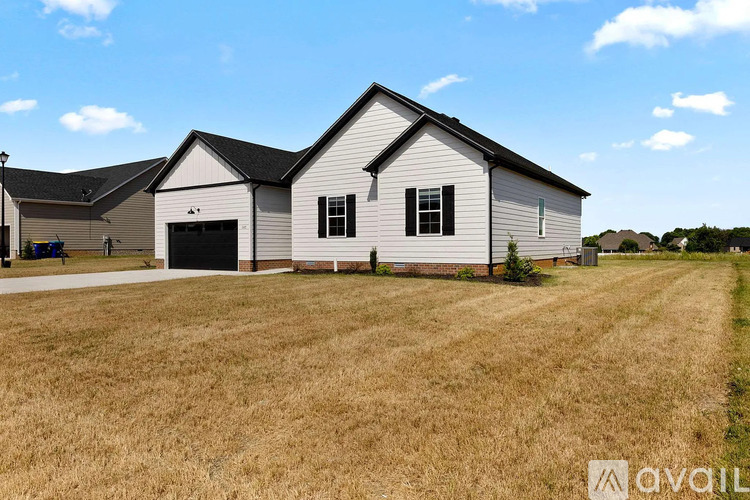 A large house with a garage is available for sale.
