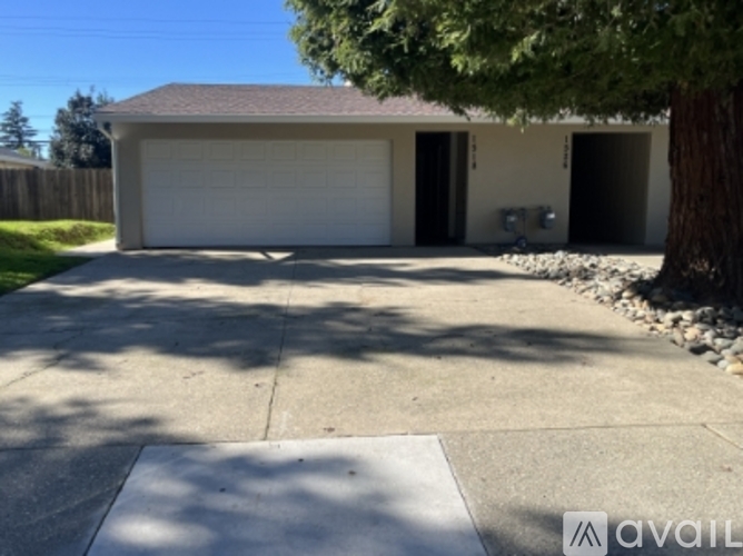 A house with a garage and a driveway.