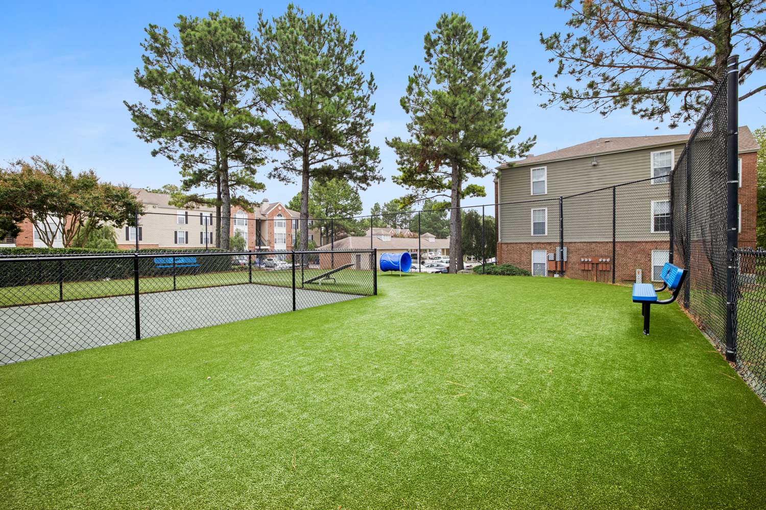 Spacious, off-leash dog park with green grass and fencing for residents of Stonebridge Crossing