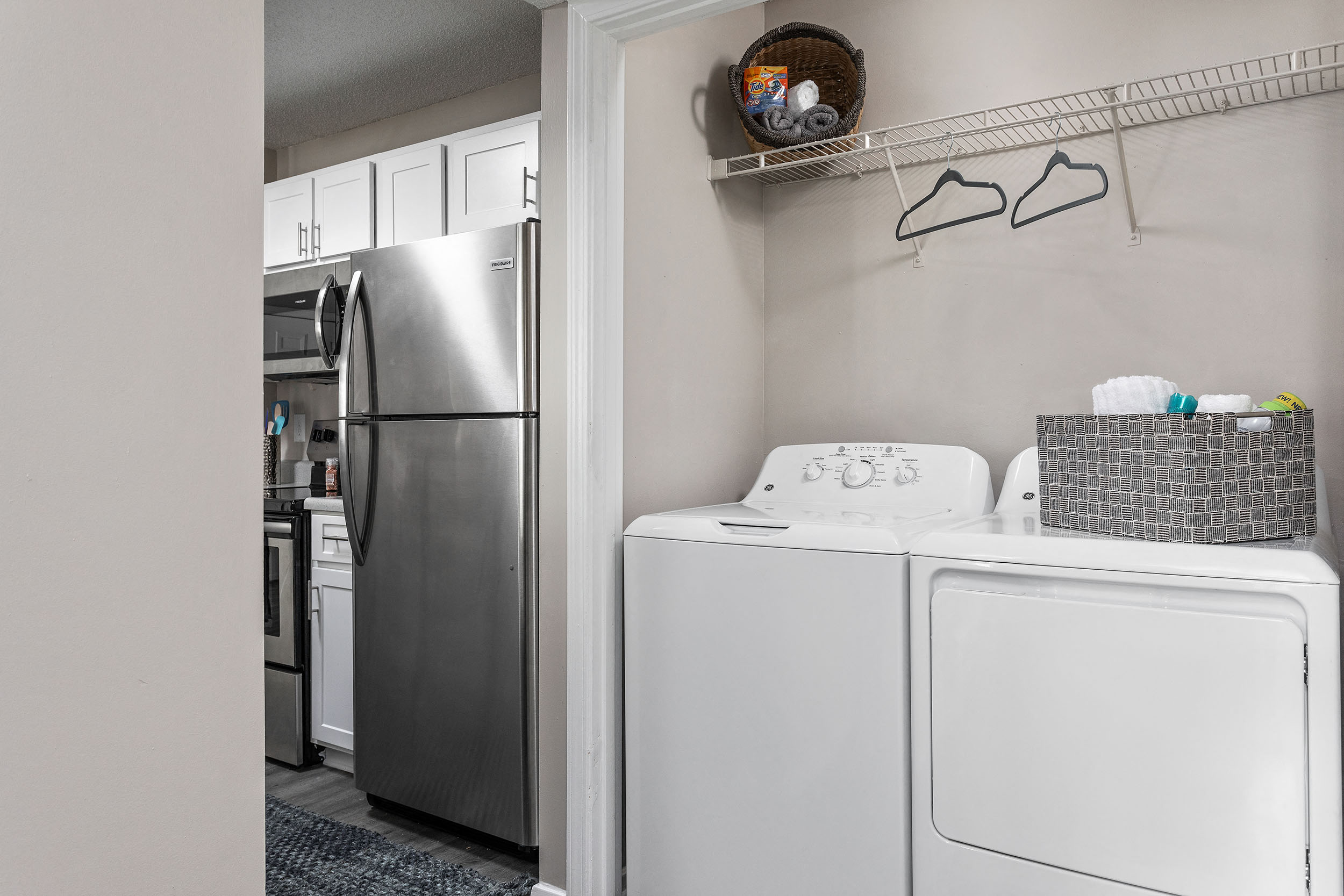 In-unit, full-size washer and dryer with storage shelf in Cordova apartment for rent