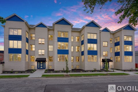 A building with a blue and white facade is available for rent.