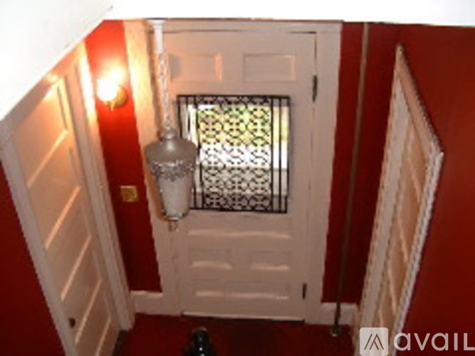 A white door with a glass window in the middle.