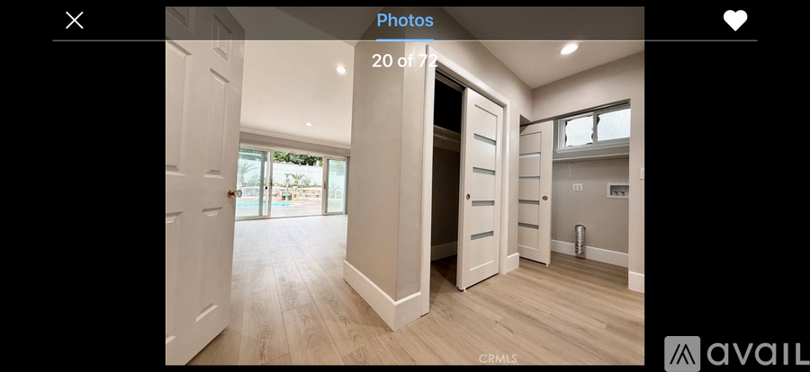 A photo gallery with a photo of a room showing a door and a window.