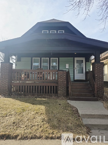 A house with a porch and a covered entrance.