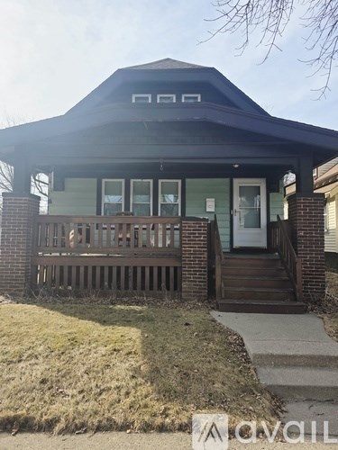 A house with a porch and a covered entrance.