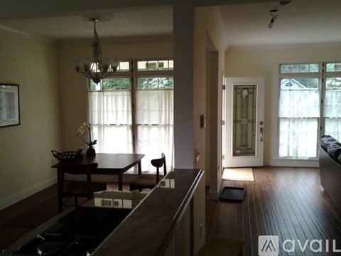 A living room with a brown table and chairs.