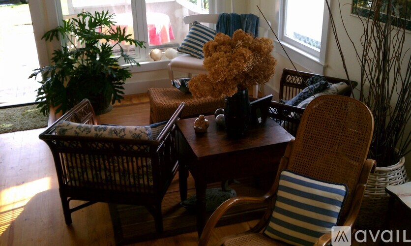 A living room with a brown chair and a brown table.