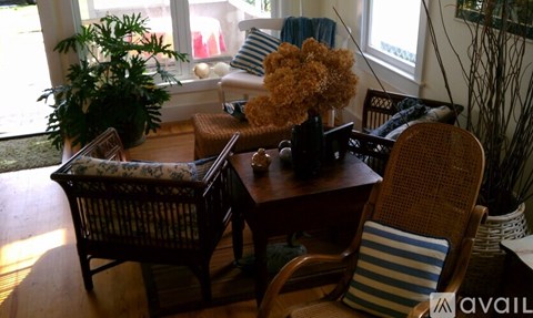 A living room with a brown chair and a brown table.