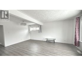 A room with a bench and a window.