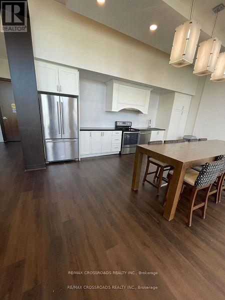 A kitchen with a table and chairs in the middle of the room.