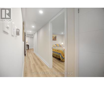 A bedroom with a bed and a mirror on the wall.
