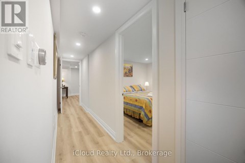 A bedroom with a bed and a mirror on the wall.