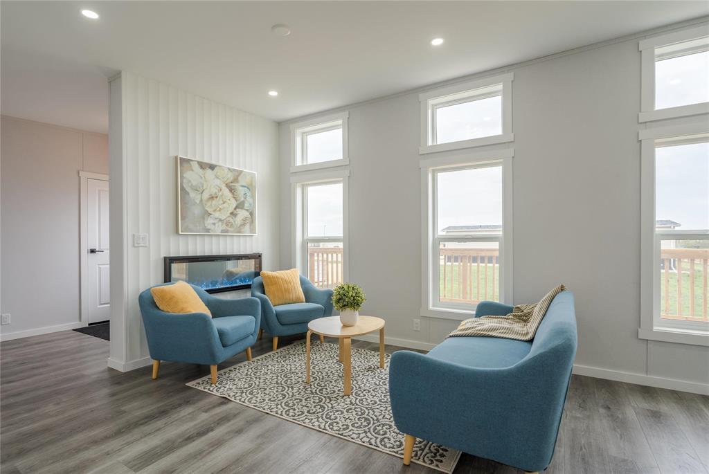 A living room with a blue sofa and a wooden coffee table.