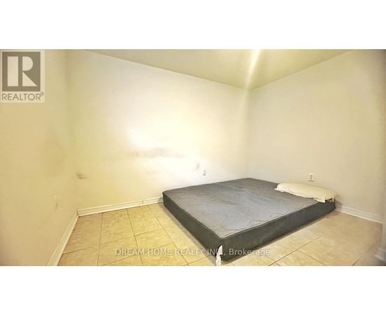 A bedroom with a bed and a mattress in it.