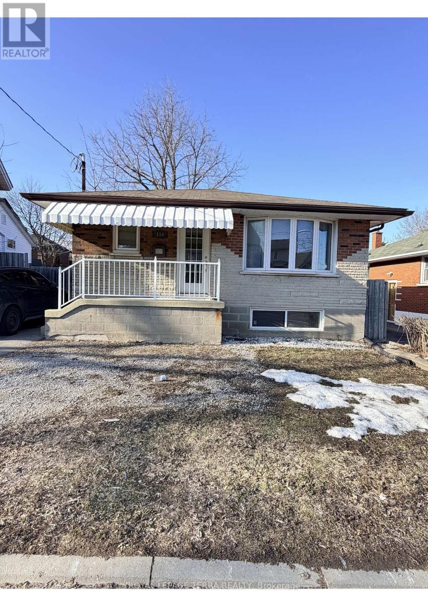 A house with a car parked in front.