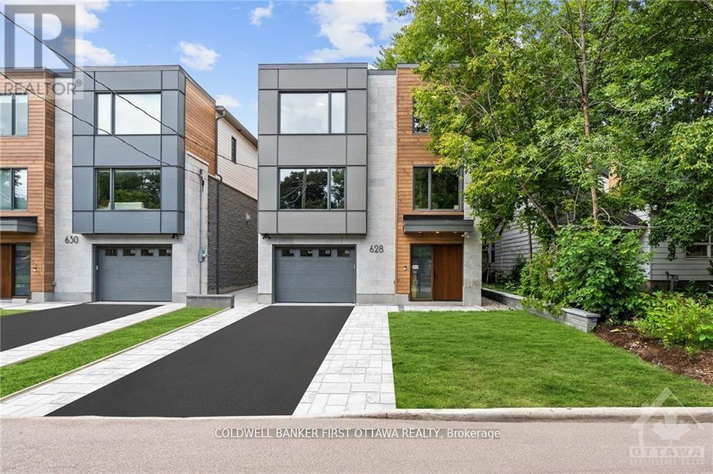 A modern two-story townhouse with a garage is for sale.