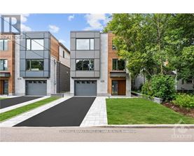 A modern two-story townhouse with a garage is for sale.