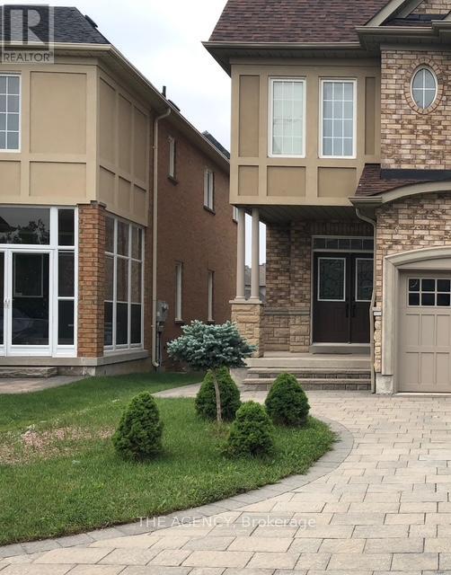 A house with a brown and beige exterior is shown.