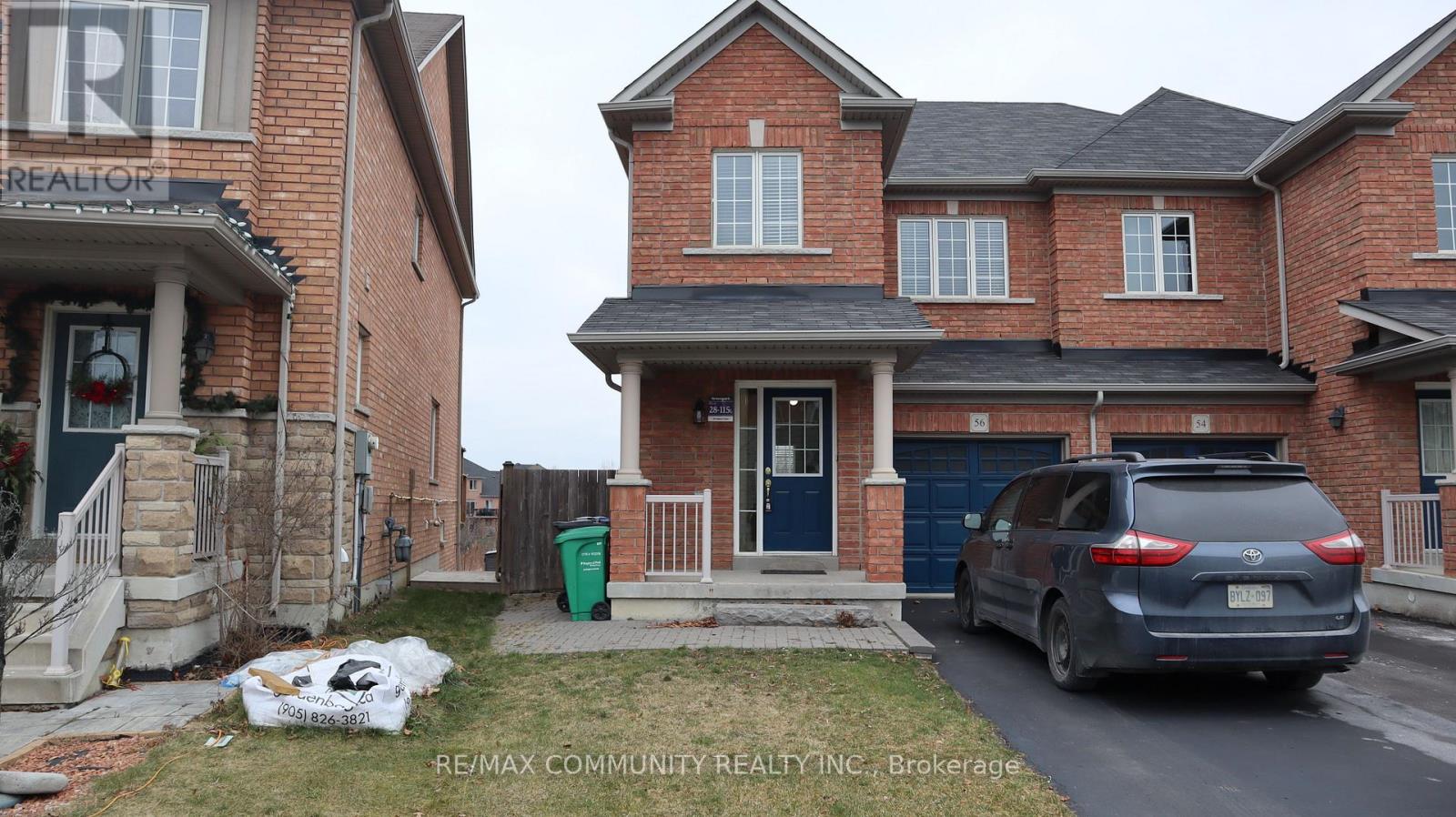 A house with a car parked in front of it.