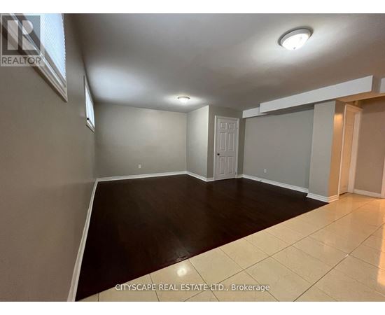 A spacious room with a door and a window.