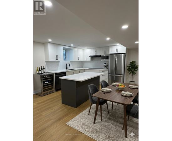 A modern kitchen with a dining table set for four.