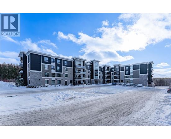A large apartment complex with a REALTOR® logo in the corner.