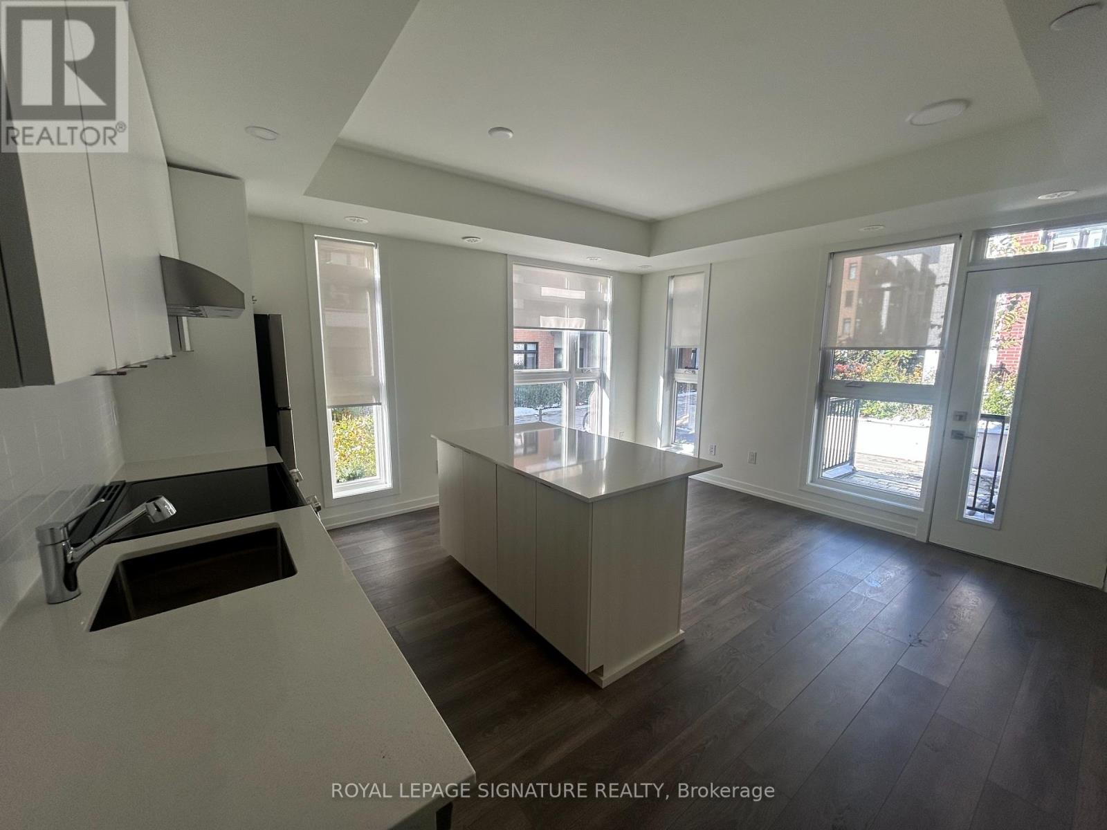 A modern kitchen with a sink and a countertop.