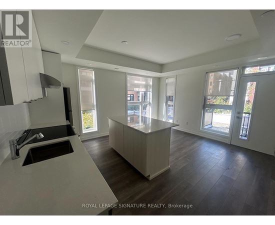 A modern kitchen with a sink and a countertop.