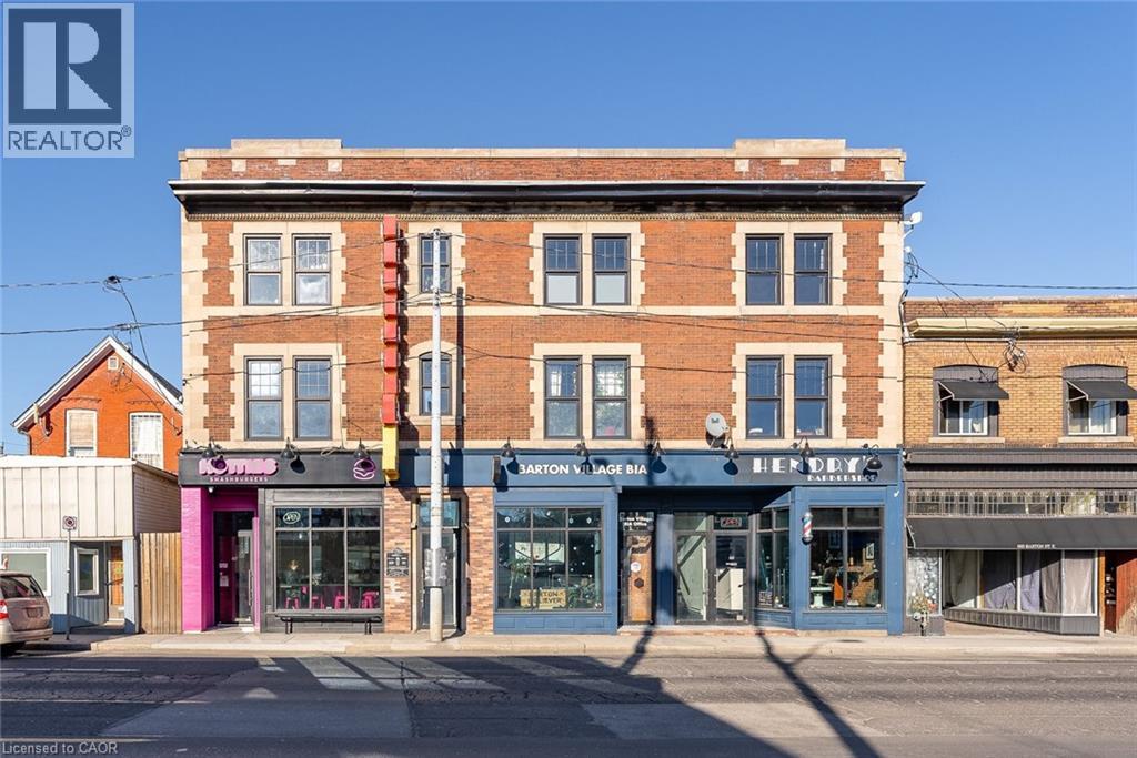A street view of a building with a sign that says "REALTOR".