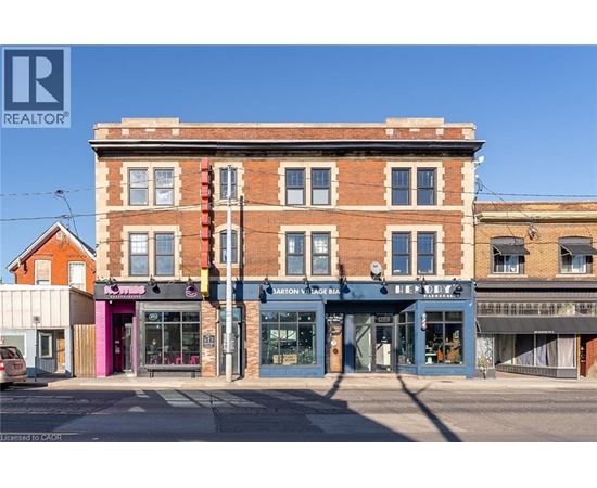 A street view of a building with a sign that says "REALTOR".