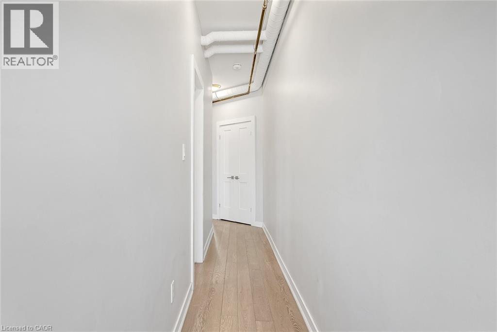 A long hallway with a door at the end.