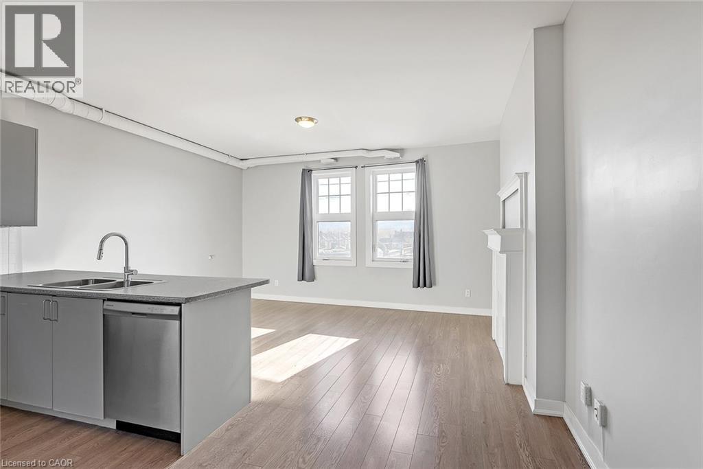 A kitchen with a sink and a window.