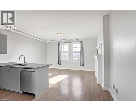 A kitchen with a sink and a window.