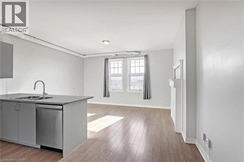 A kitchen with a sink and a window.