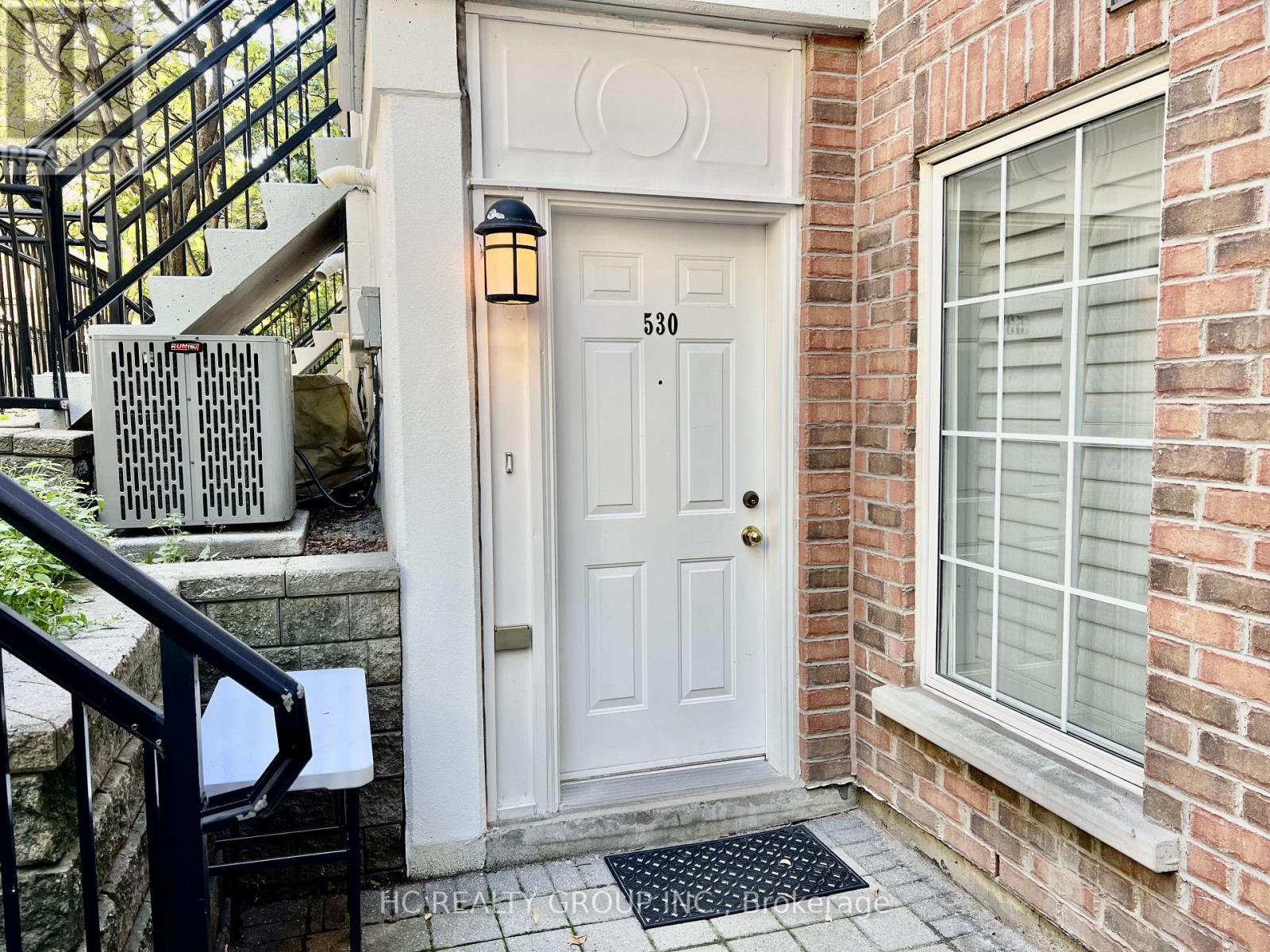 A white door with the number 530 on it is the main focus of the image.