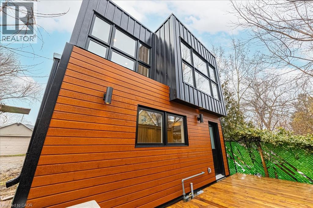 A modern house with a black and orange exterior.