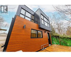 A modern house with a black and orange exterior.