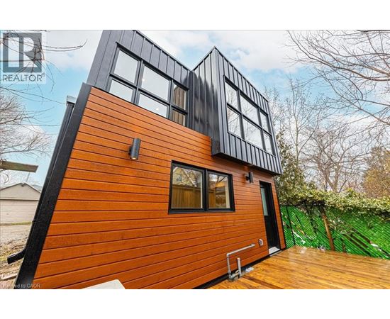 A modern house with a black and orange exterior.